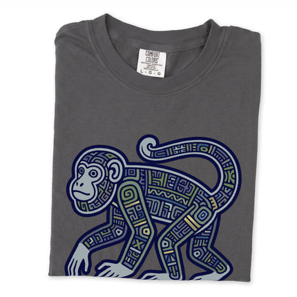 Tribal Mayan monkey graphic tee featuring geometric ancient symbols and jungle art print.