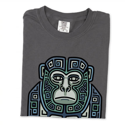 Mayan monkey tribal art t-shirt featuring blue and green geometric patterns on a unisex tee.