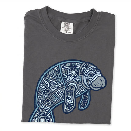 Tribal geometric manatee print t-shirt featuring stylized ocean animal art.