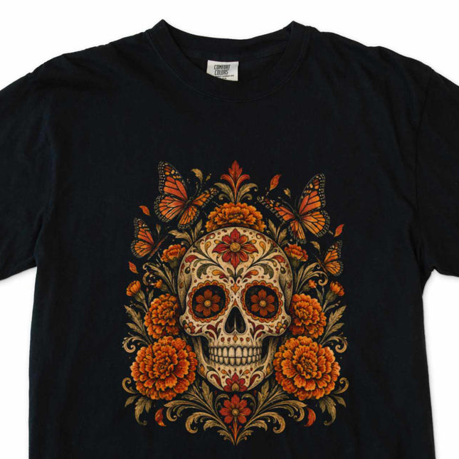 Calavera skull art with marigolds and butterflies on a black tee.