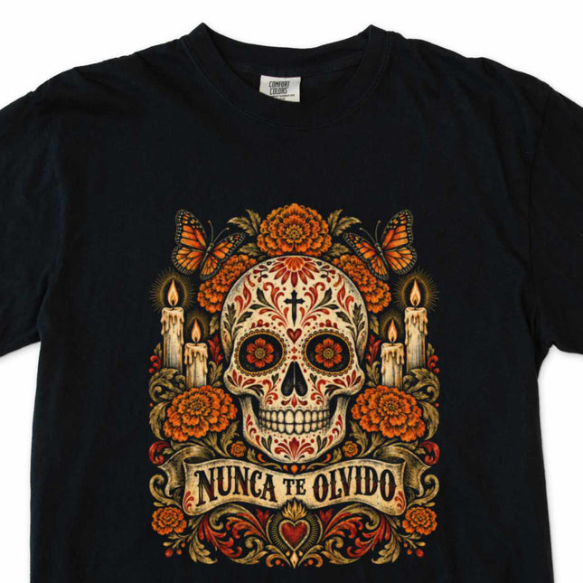 Nunca Te Olvido t-shirt with remembrance skull, flowers, and candles memorial design.