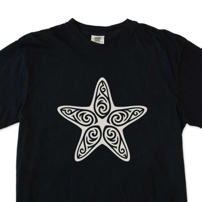 Ornate tribal starfish graphic tee on a black shirt.