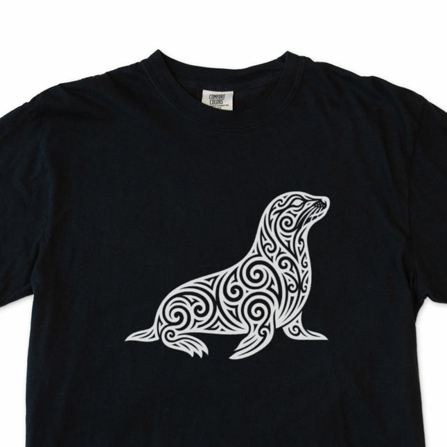 Tribal swirl seal graphic t-shirt featuring ornate marine animal art.