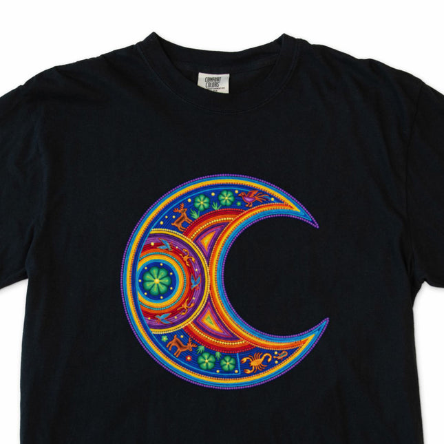 Colorful Huichol-inspired crescent moon graphic tee featuring vibrant Mexican folk art patterns.