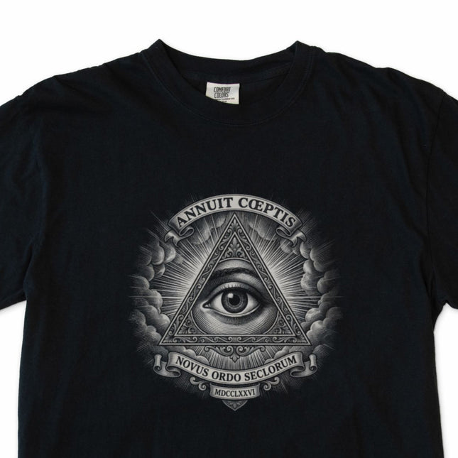 Black tee featuring the Eye of Providence and Annuit Coeptis seal graphic.