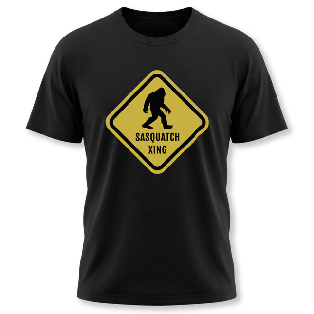 Yellow Sasquatch crossing caution sign graphic tee on a black t-shirt.