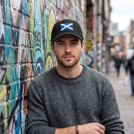 Black baseball cap featuring the blue and white Scottish Saltire flag design.