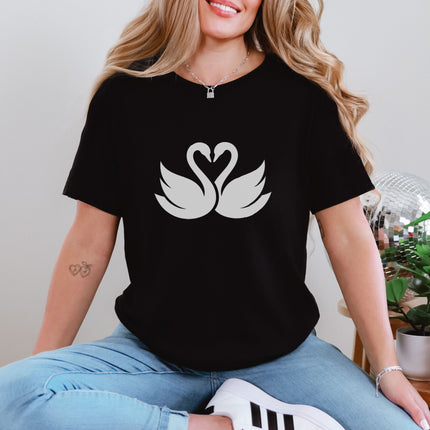 Swans forming a heart graphic on an elegant couple's love unisex t-shirt design.