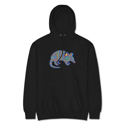 Colorful Mexican folk art hoodie featuring a huichol armadillo with tribal sun and cactus designs.