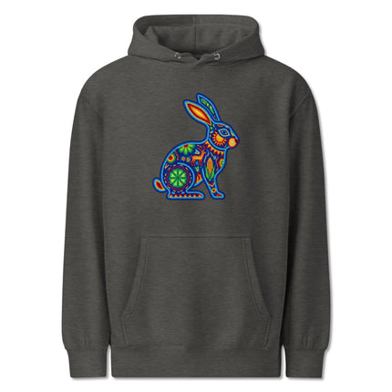 Colorful hoodie featuring Huichol Mexican folk art design with vibrant rabbit patterns.