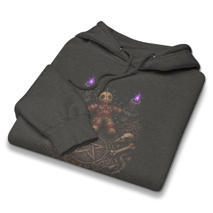 Dark magic ritual table hoodie with occult pentagram and gothic doll graphic print.