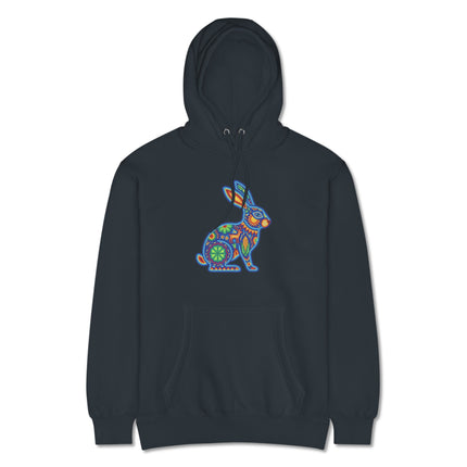 Vibrant Huichol rabbit pattern on a pullover hoodie, featuring colorful Mexican folk art style.