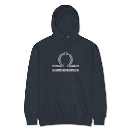 Intricate Libra scales zodiac symbol design printed on a cozy astrology pullover hoodie.