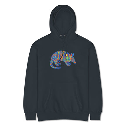 Colorful tribal armadillo hoodie featuring vibrant Huichol Mexican folk art sun and cactus designs.
