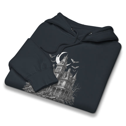 Gothic haunted house hoodie featuring spooky mansion, bats, and full moon graphic design.