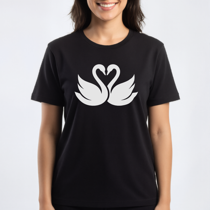 Swans forming a heart graphic on a black t-shirt.